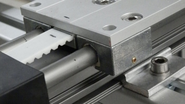 Positionierung Armstapler drylin Zahnriemenachse